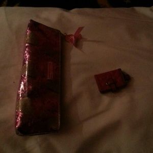 A Victoria's secret makeup bag and a coach keychai