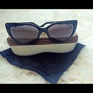 Black Vogue cat-eye sunglasses.
