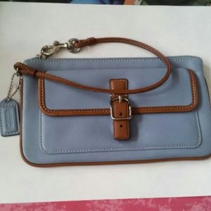 Gently used blue coach clutch