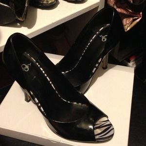 Super cute zebra inside black patent pumps!'