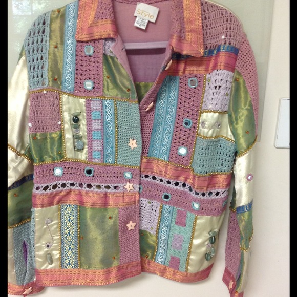 This jacket has a little bit of everything. Size M