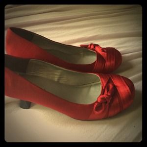 Selling cute red high heel shoes brand : metaphor