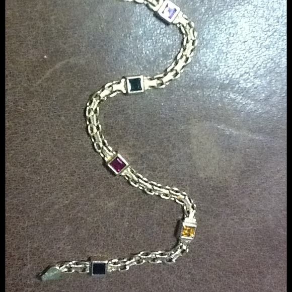 A 14 Karat Gold bracelet with precious stones.