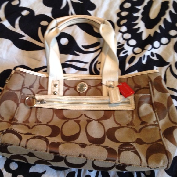 Tan and white coach bag