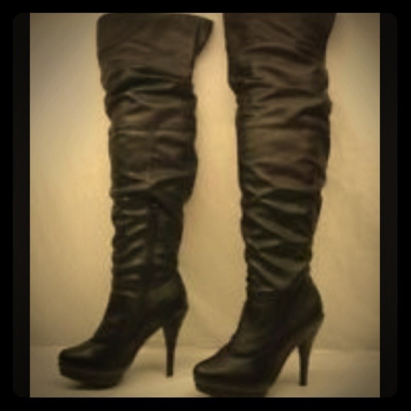 Knee high black faux leather boots