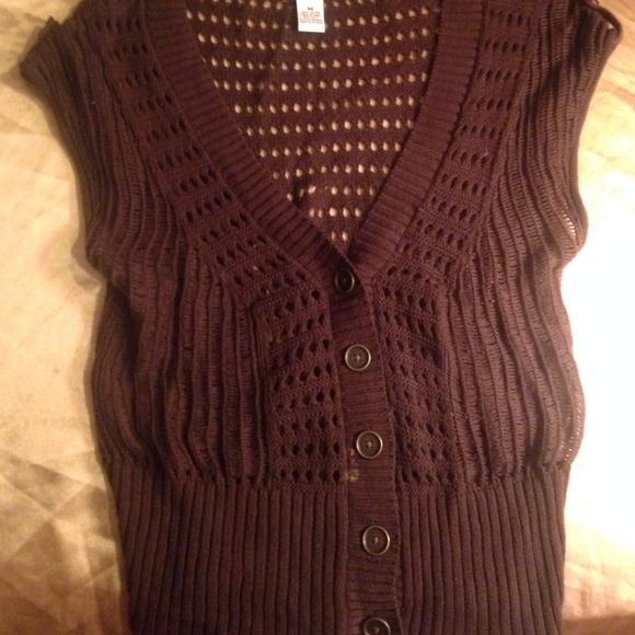 A brown sweater/ cardigan