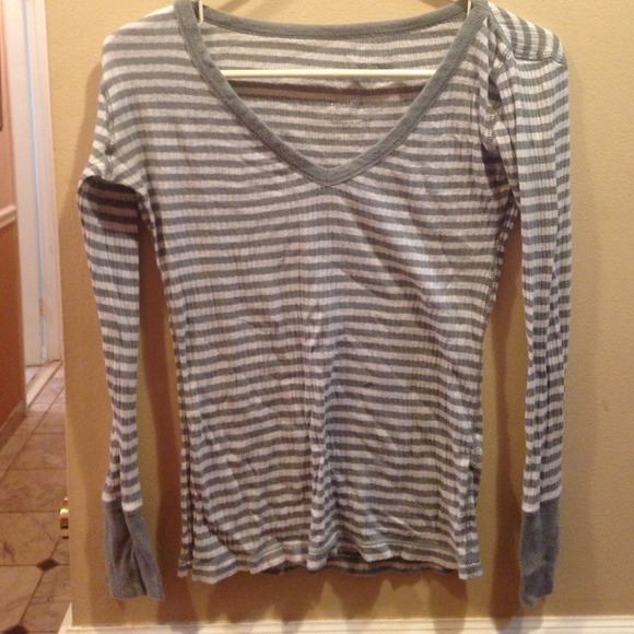 A grey striped long sleeve shirts
