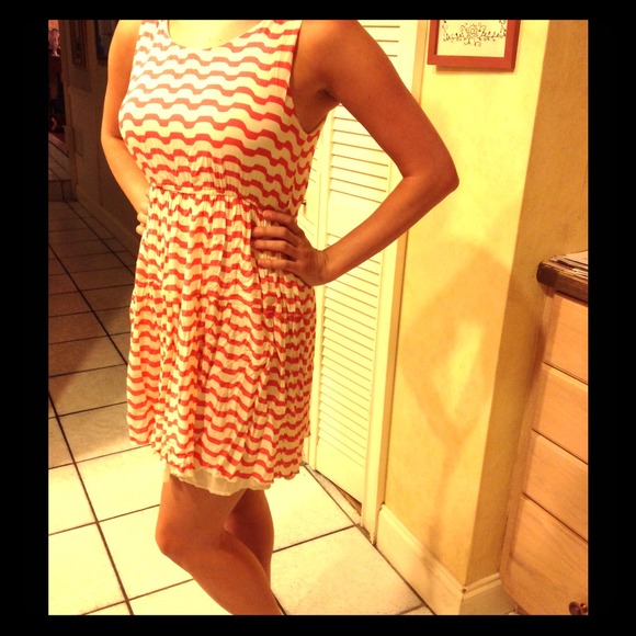 Orange and cream striped sleeveless sundress.
