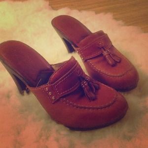 Michael Kors tasseled mule clogs.