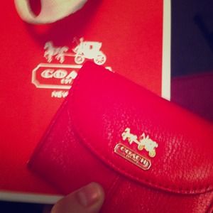 Bright hot pink Coach mini wallet