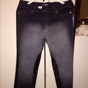 Dark denim BeBe jeans. Faded white and leather.