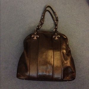 A used Tory Burch black handbag