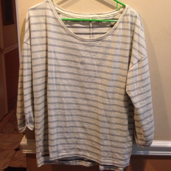 A stripped white and grey shirt