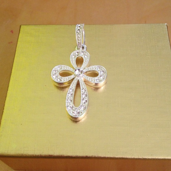 Silver Cross with cubic zirconia accents.