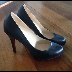 Christian Louboutin black leather pumps