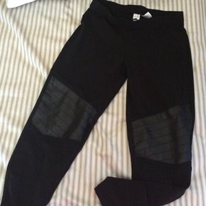 Legging with leather look patch.