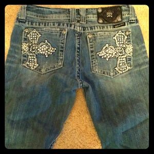 Distressed bootcut miss me jeans..