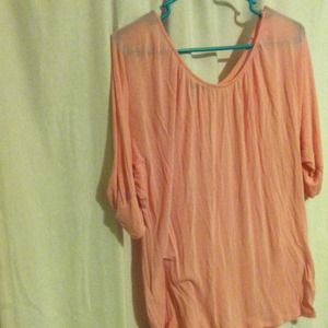 Oversize light pink shirt.