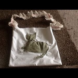 White vinyl cat tote. Pink and white lace strap.