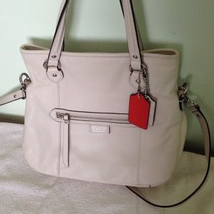 Cream color leather fold over cross body satchel.