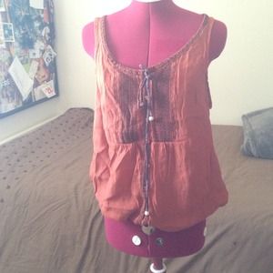 Orange lose but fitted at the bottom shirt