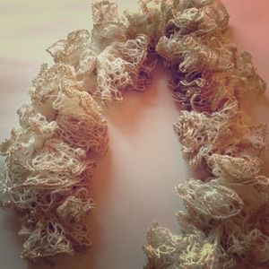 Gold and white hand knit scarf.