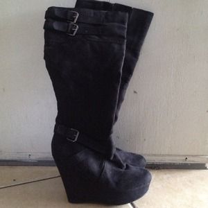 Suede knee high wedge boots.