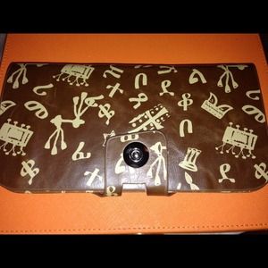 Brown leather wallet with Ethiopian alphabet.