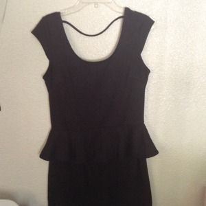 All black peplum dress.