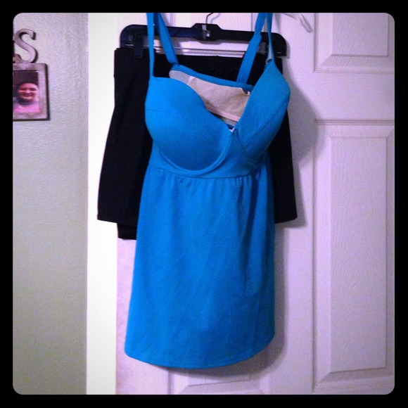 Teal swimsuit top with black bottoms