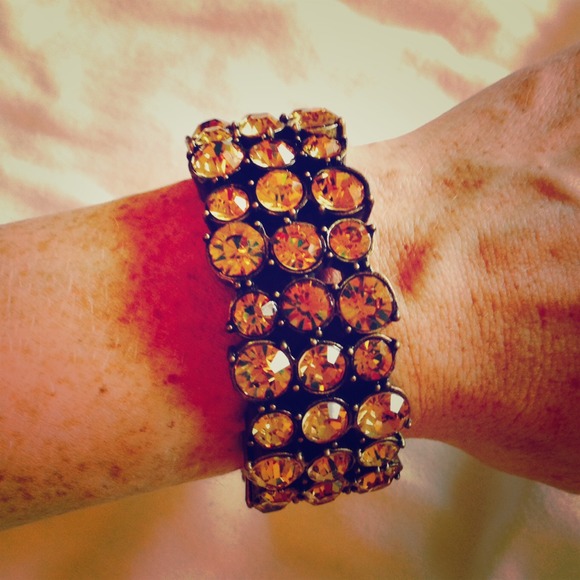 Jeweled burnt orange bracelet.