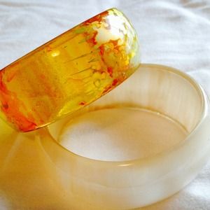 Bangle bracelets. Orange and pearl colored.