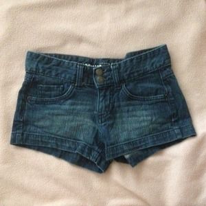 Denim dark wash low waisted shorts.