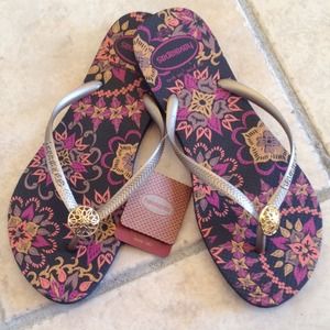 Havaianas Shoes - New Havaianas Slim Thematic black w/gold charm Havaianas Shoes - New Havaianas Slim Thematic black w/gold charm