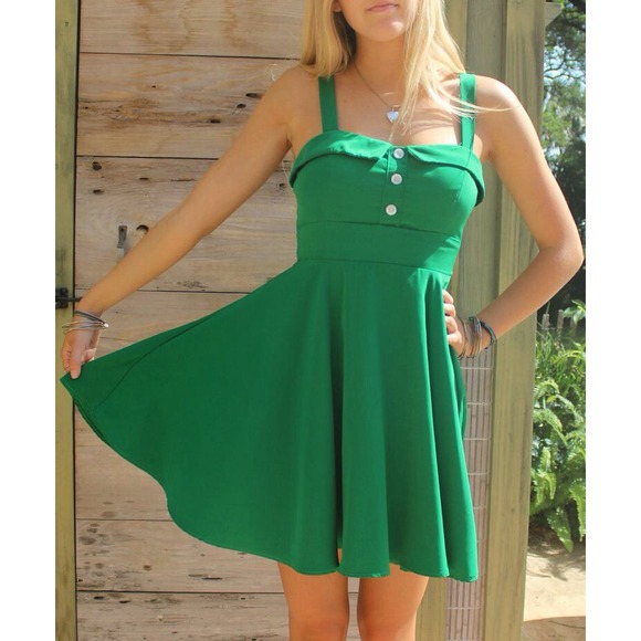 Green pinup style dress with white buttons