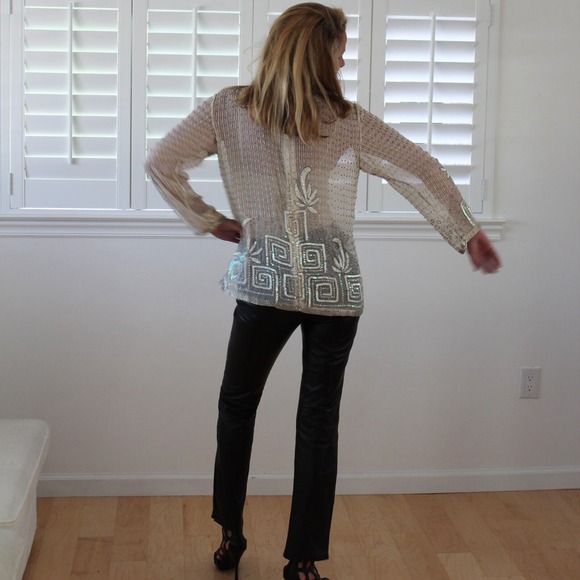 Beaded with sequins, in a creamy background. - Picture 2 of 3