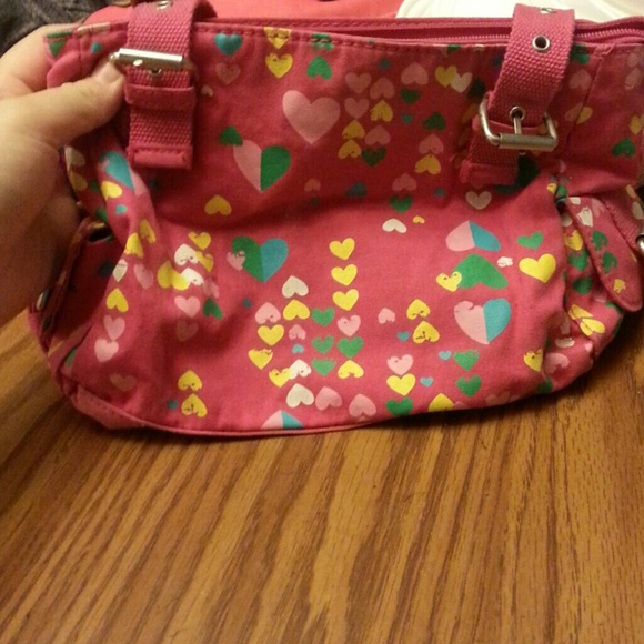 Pink with pink ,yellow,green,and blue harts in it