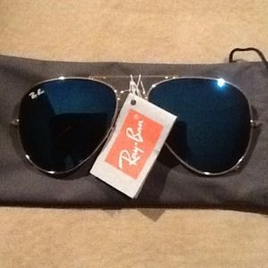 Ray-Ban sunglasses.  Gold with polarized lenses