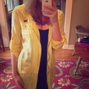 Yellow, thin jacket, with a hood.