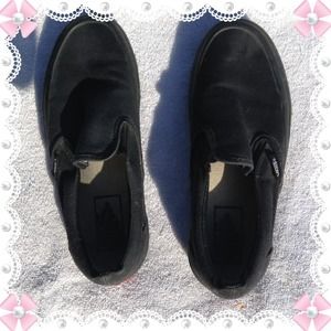 All black Slip on Vans