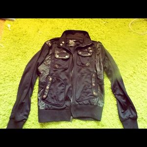 Unisex Black faux leather motorcycle jacket.