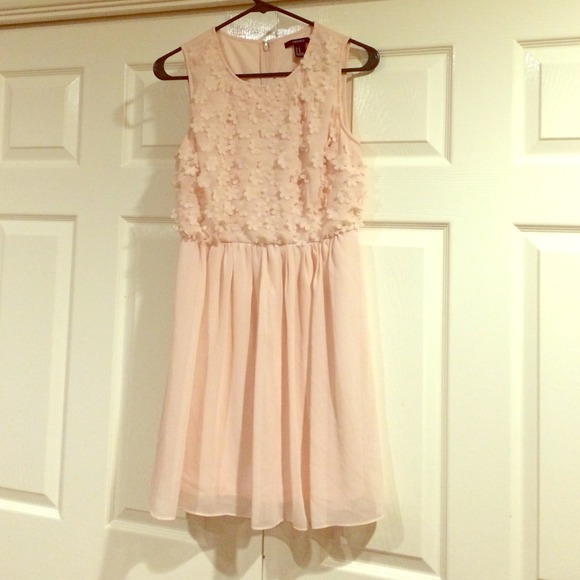 flowy pink dress with flowers on the bodice