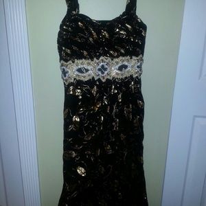 **SOLD**Sassy Gold Black Dress With Details