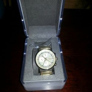 DKNY gold tone cronograph watch.