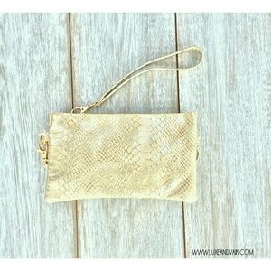 Gold vegan snakeskin wristlet to crossover purse
