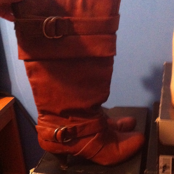 Pair of brown boots with heels