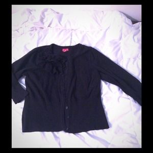 Simple black cardi with ruffles and rosettes