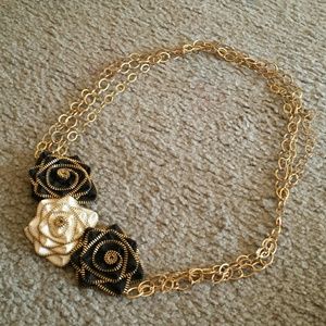 Gold necklace with b and w roses