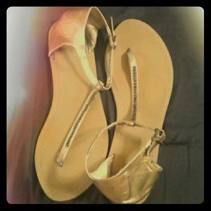 Metallic gold flip flops