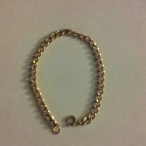 gold bracelet an a  silver bracelet.